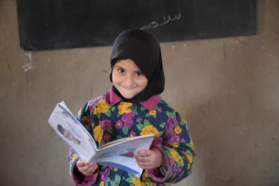On 2 February 2022 in Afghanistan, a girl learns to read in front of a blackboard at a community-based education (CBE) center in Shurandam village, Kandahar city.