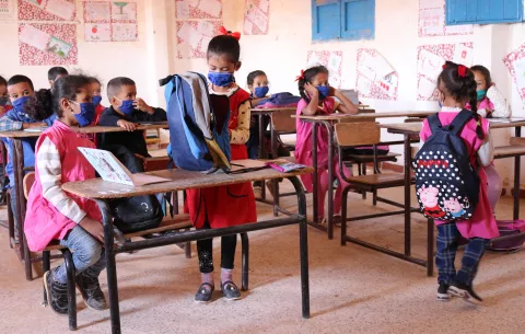 Masked children in a classroom at Tindouf refugee camps