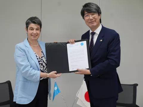 Emma Brigham, Deputy Representative to UNICEF Bangladesh signing an agreement with the Japanese Ambassador IWAMA Kiminori 