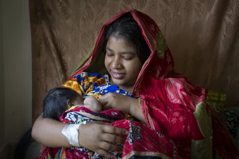 A mother breastfeed her child. Bangladesh