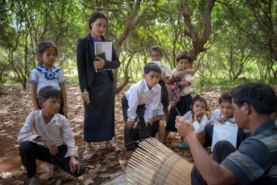 Chea Lach takes her class for an outdoor activity in the local village to learn about the animals in the area and the local tradition of basket weaving. 