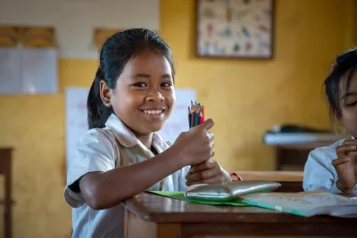 11-year old Loul Bopha in her classroom. Her school runs the multilingual education curriculum which means she can study in her indigenous language of Kreung while she learns the national language of Khmer.