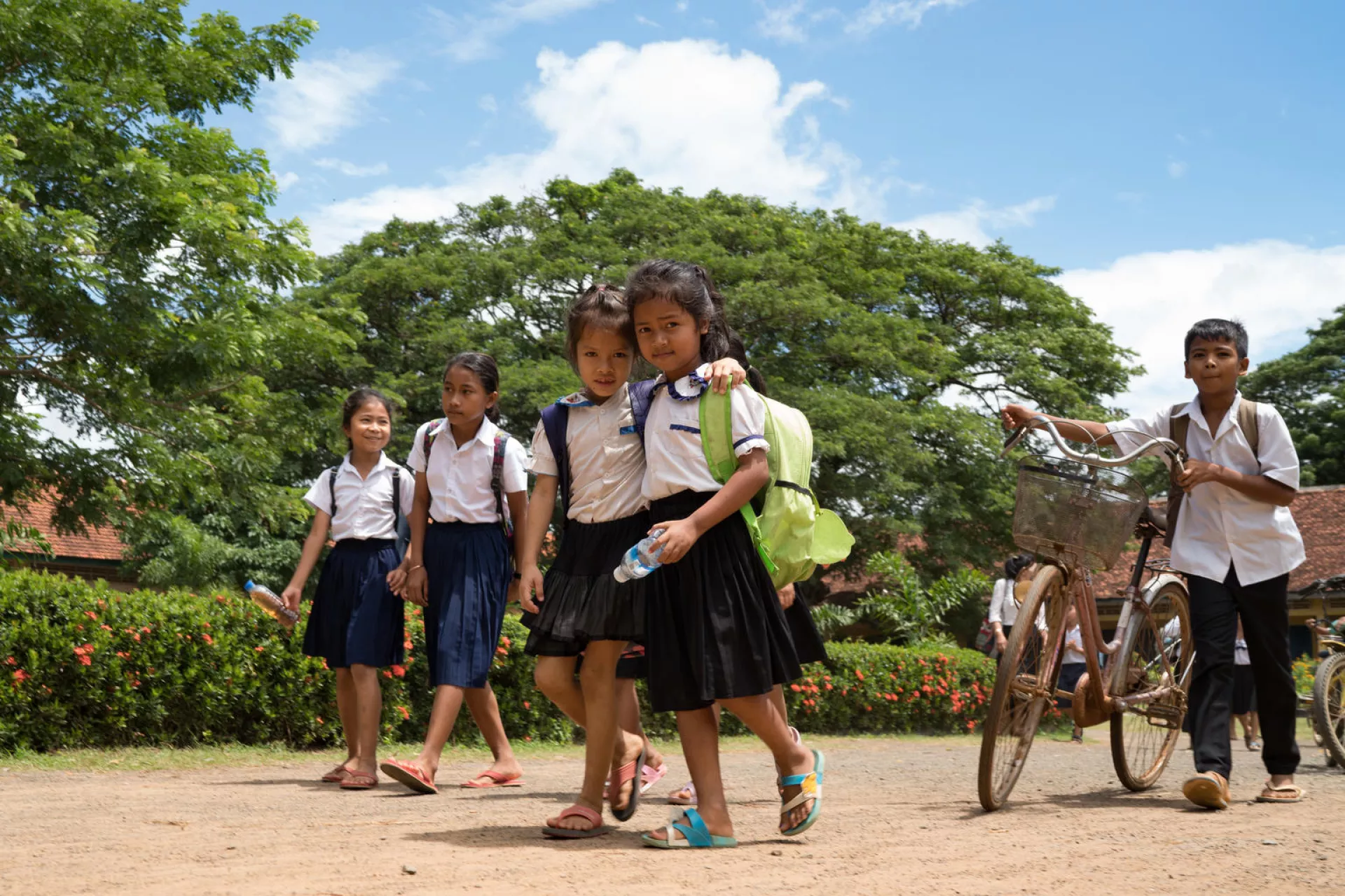 Groups of students leave school at Kampong Thmar Primary School, Kang Sao village, Santok district, Kampong Thom commune, Kampong Thom province on July 5, 2018.