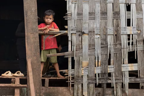 A boy in his home in Kak Village, Kak commune, Borkeo Disctrict, Ratanakiri