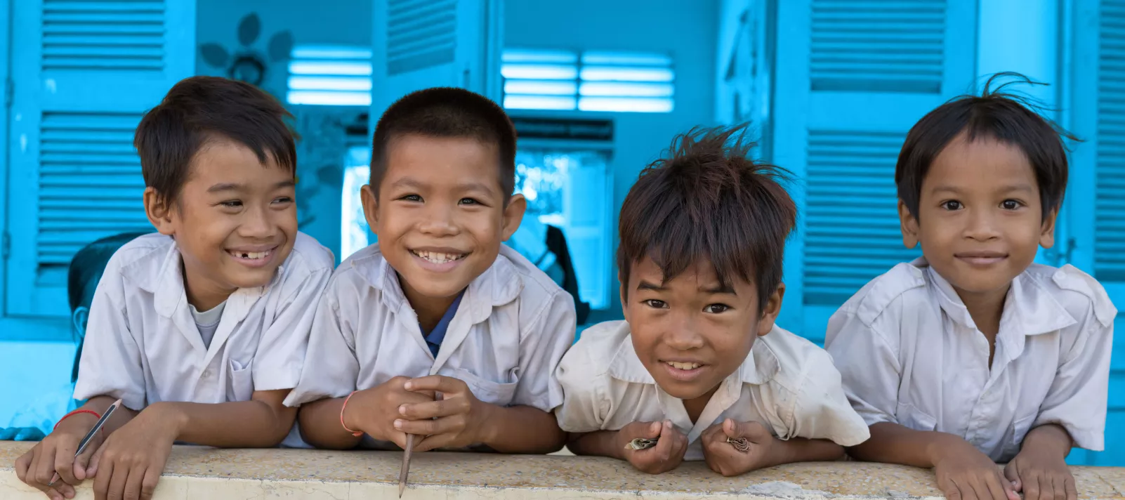 Children smile at the camera at Watanak Chhoung Leap Primary School in Sa’ang District, Kandal province on July 2, 2018. 