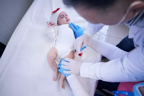 A baby receives a vaccine.