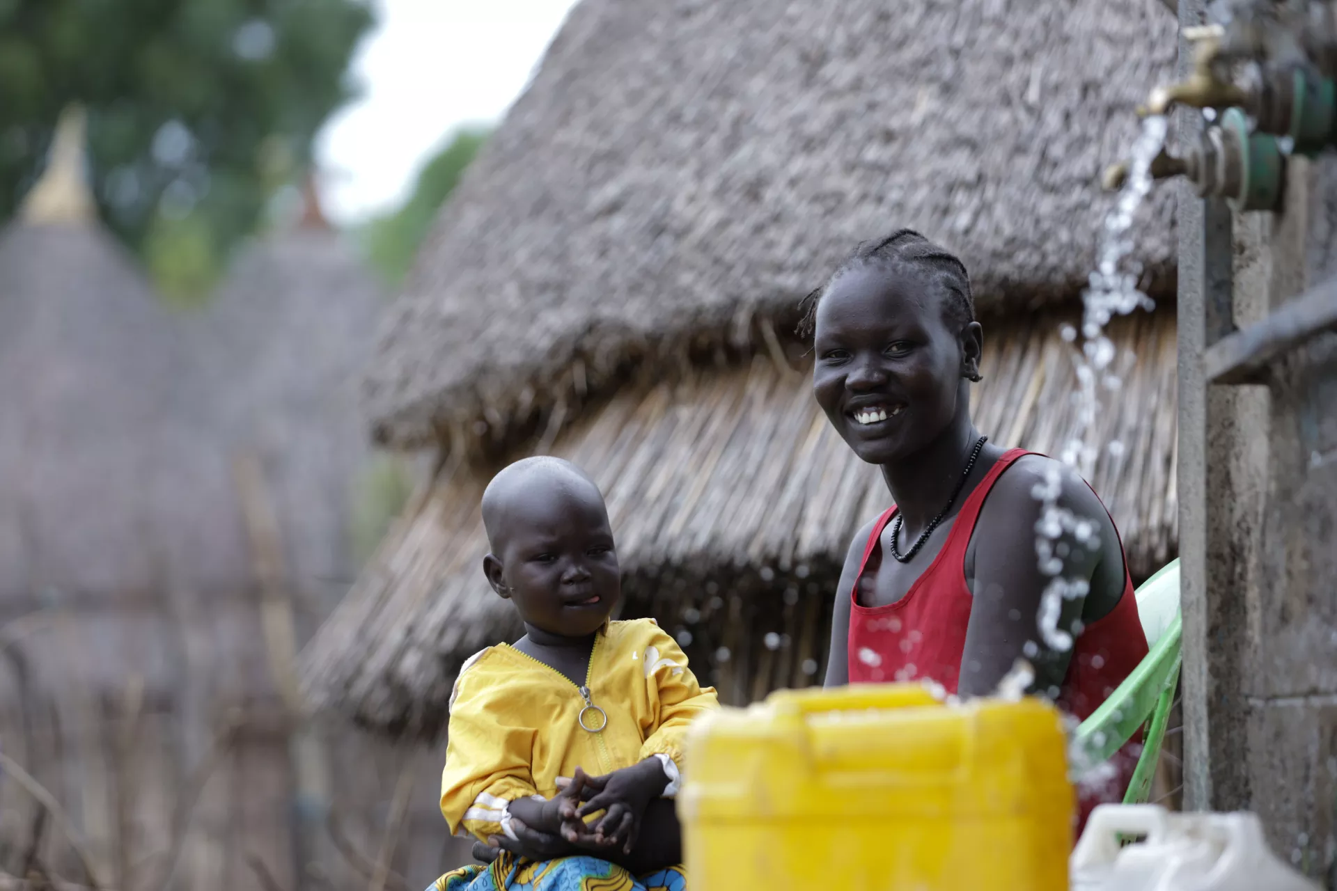 Nyachan Joak, a mother of four children, with her child.