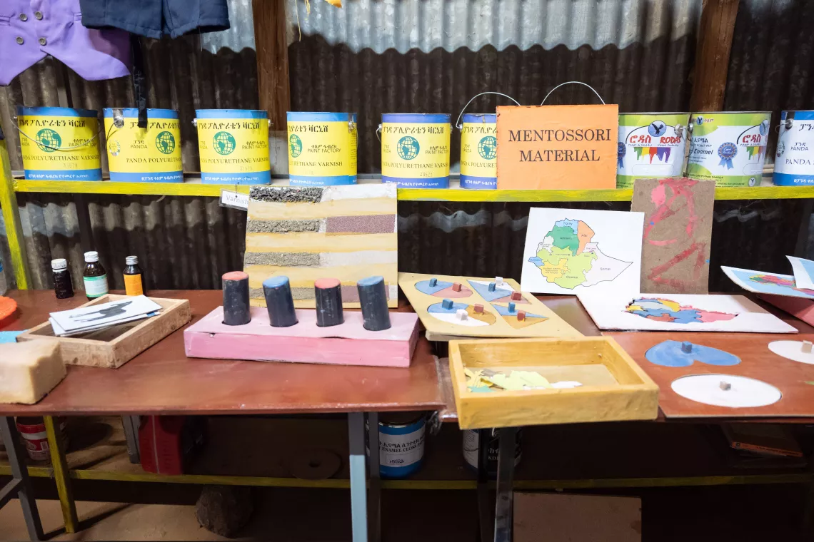 Montessori learning materials on a shelf 