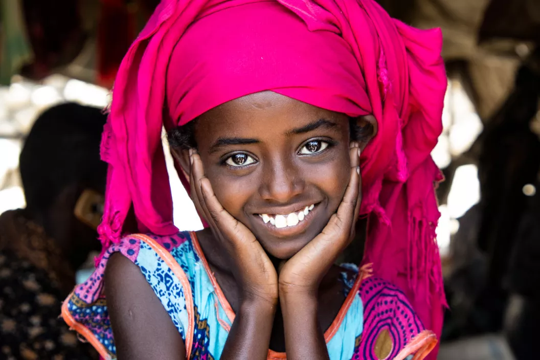 A young girl smiling