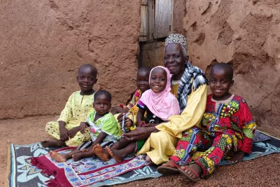 Zamigu Issah, the local Imam, with his children and grandchildren in the village of Kpano in the Northern Region of Ghana on 18 July 2015.