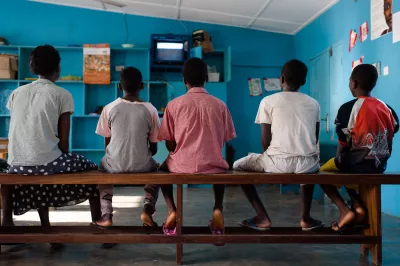 Children watching the television while they wait for breakfast at the state Shelter for Abused Children in Accra, Ghana on 12 May 2015.