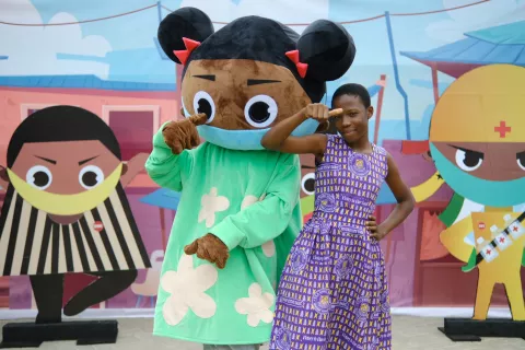 girl on right with oversized animation figure 