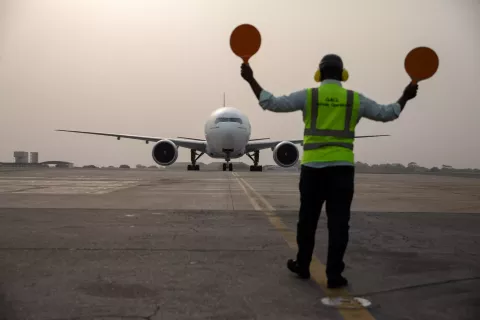 An airplane carrying vaccines lands at Kotoka International airport. 