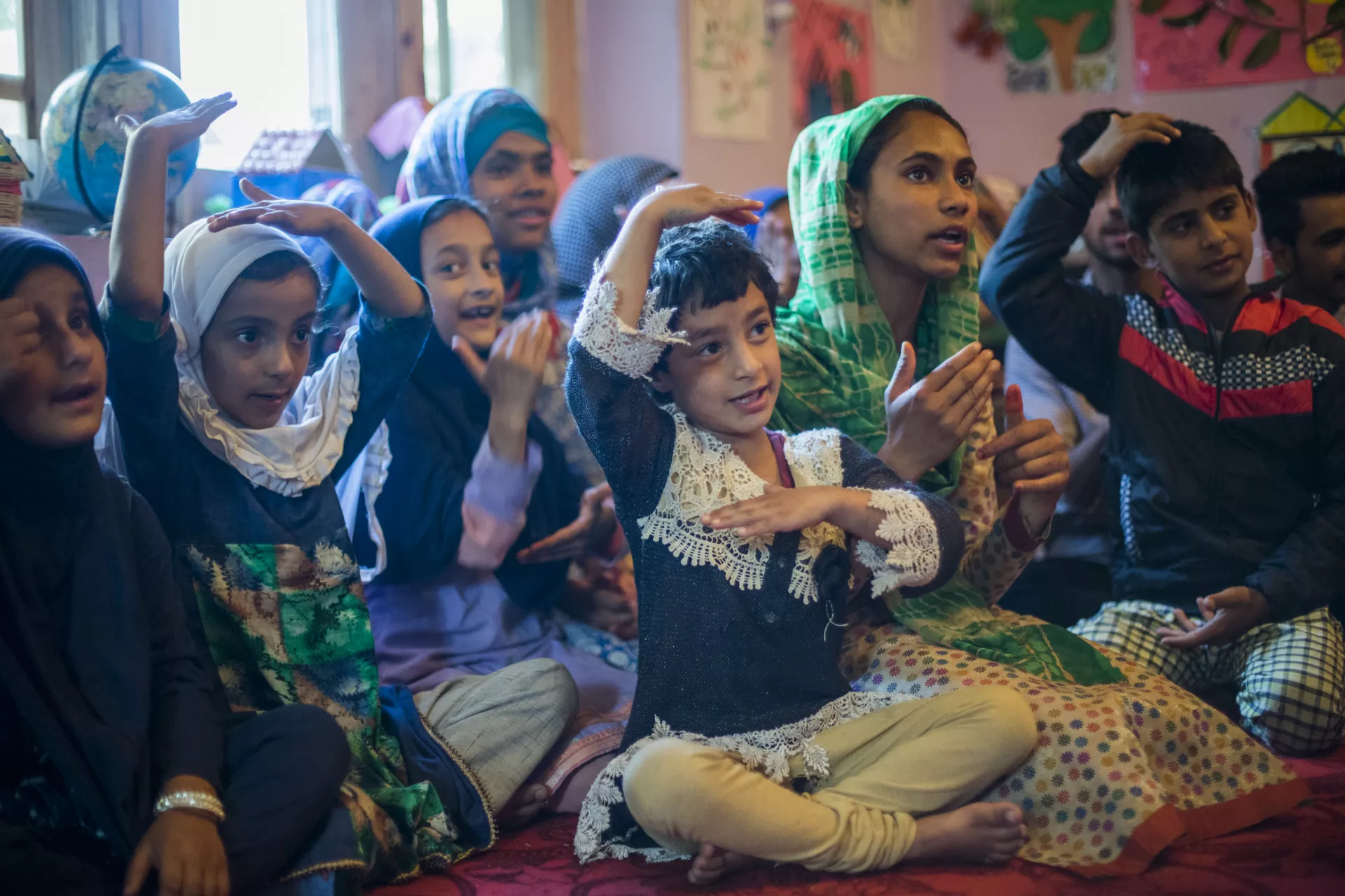 Children react during an activity at the Child Friendly Space (CFS) in Pamposh colony of Srinagar in Jammu and Kashmir.