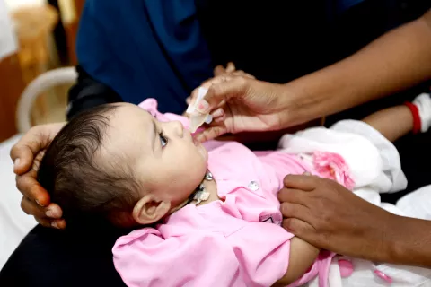 Doctor giving vaccine to the child.