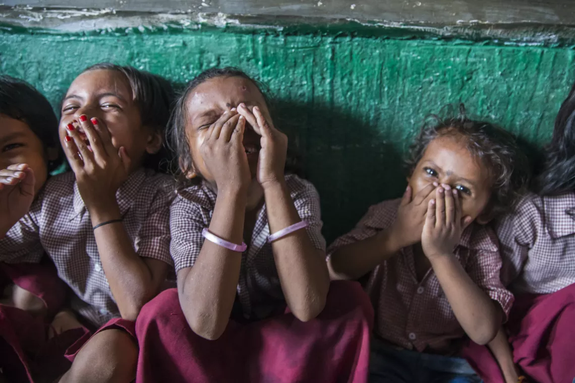 Children react during an activity at an Anaganwadi center in Cherki, Bihar.