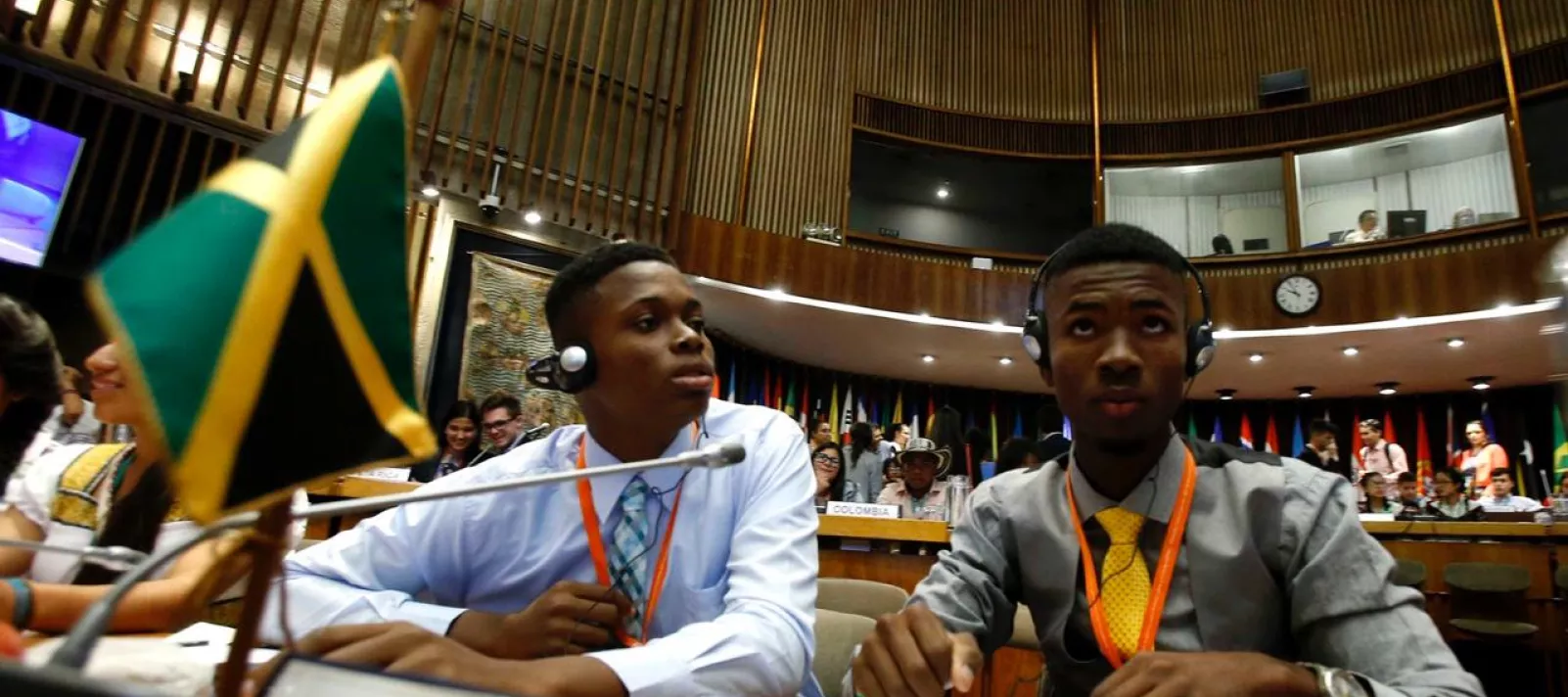 Photograph of Cameron Campbell (left) representing the Peace Management Initiative (PMI), and Tavoy Miller, Fight for Peace, attending the First Regional Dialogue of Latin America and the Caribbean ‘On the Road to Equality’: 30 years of the Convention on the Rights of the Child, held in Santiago Chile, November 27-29, 2018.