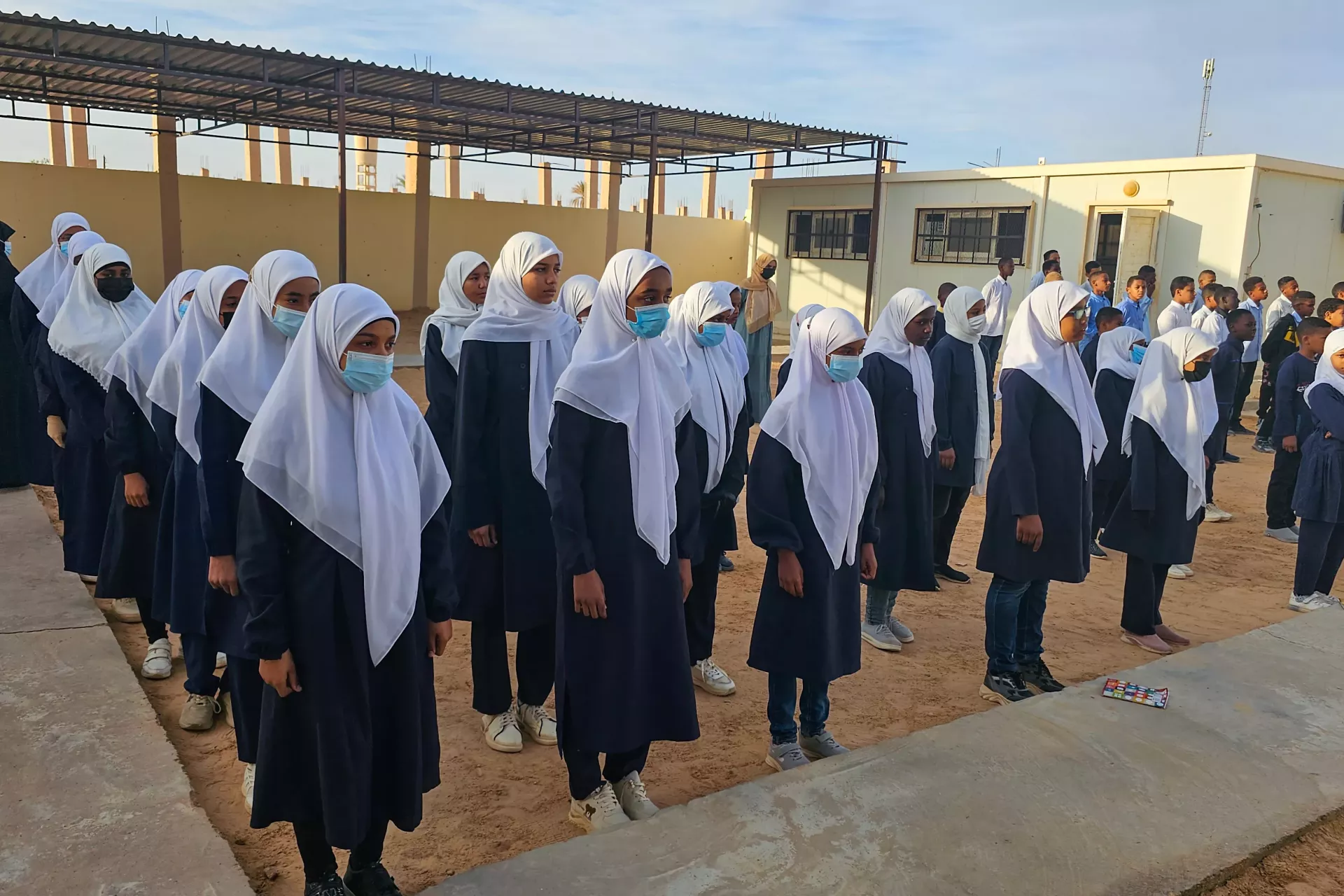 Students at Taqrouteen School line up for morning assembly infront of the new classrooms, ready to learn in their improved school facilities. Photo: ©UNICEF/Wadi Otbah/2023/Abdullah Hussein