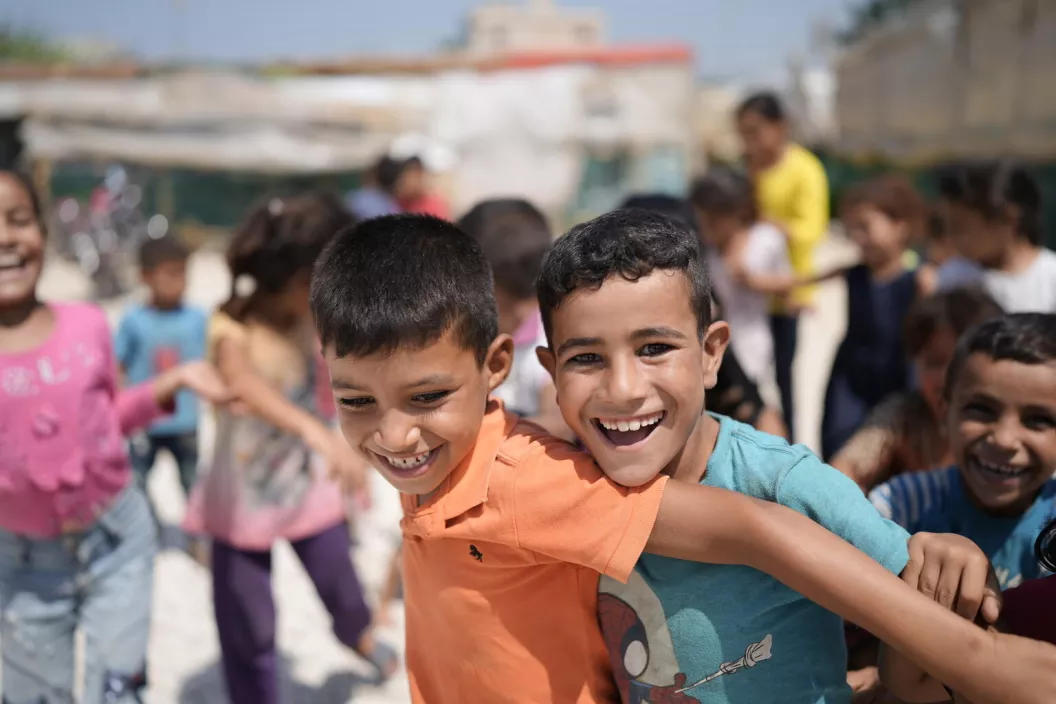Eight-year-old Hussein and nine-year-old Issa playing during UNICEF visit to Zouq Bhannine 091 informal settlement in northern Lebanon on 5 August 2021.