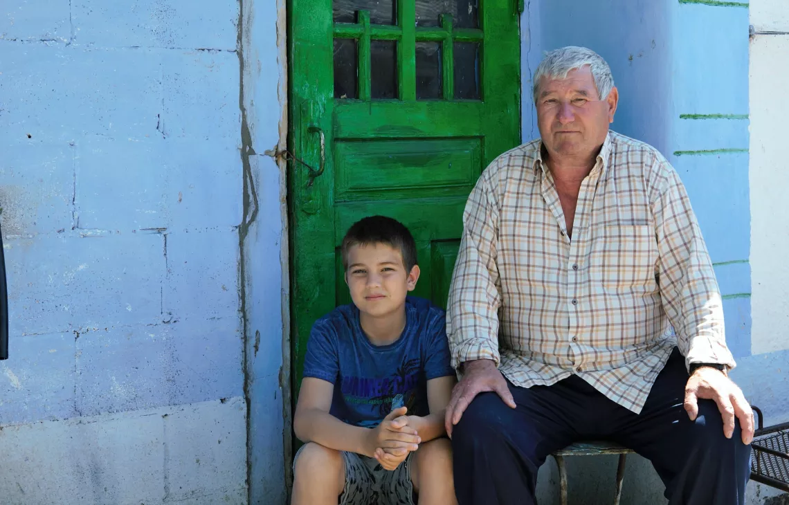 A rural boy with grandfather