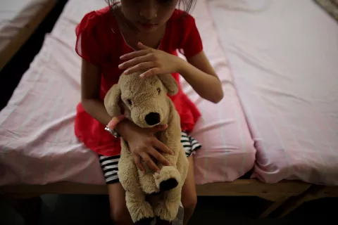 Child with stuffed toy