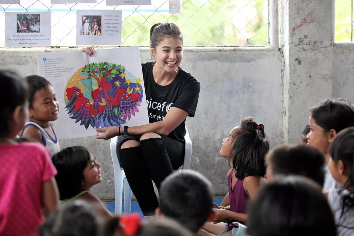 UNICEF Philippines Goodwill Ambassador Anne Curtis conducts a storytelling session with children