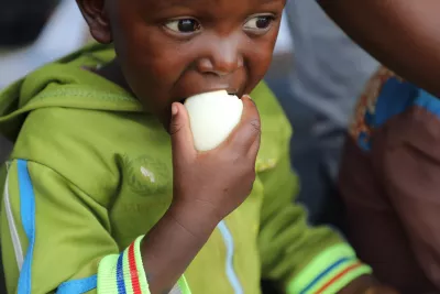 A child eating egg