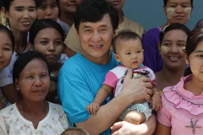 UNICEF Goodwill Ambassador Jackie Chan meets with girls from the vocational training programme at the Deaf School in Mandalay, Myanmar, in 2012.