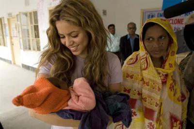 UNICEF Goodwill Ambassador Shakira holds a baby at an emergency relief distribution centre for people affected by Cyclone Sidr in Potuakhali District, Bangladesh, in 2007.