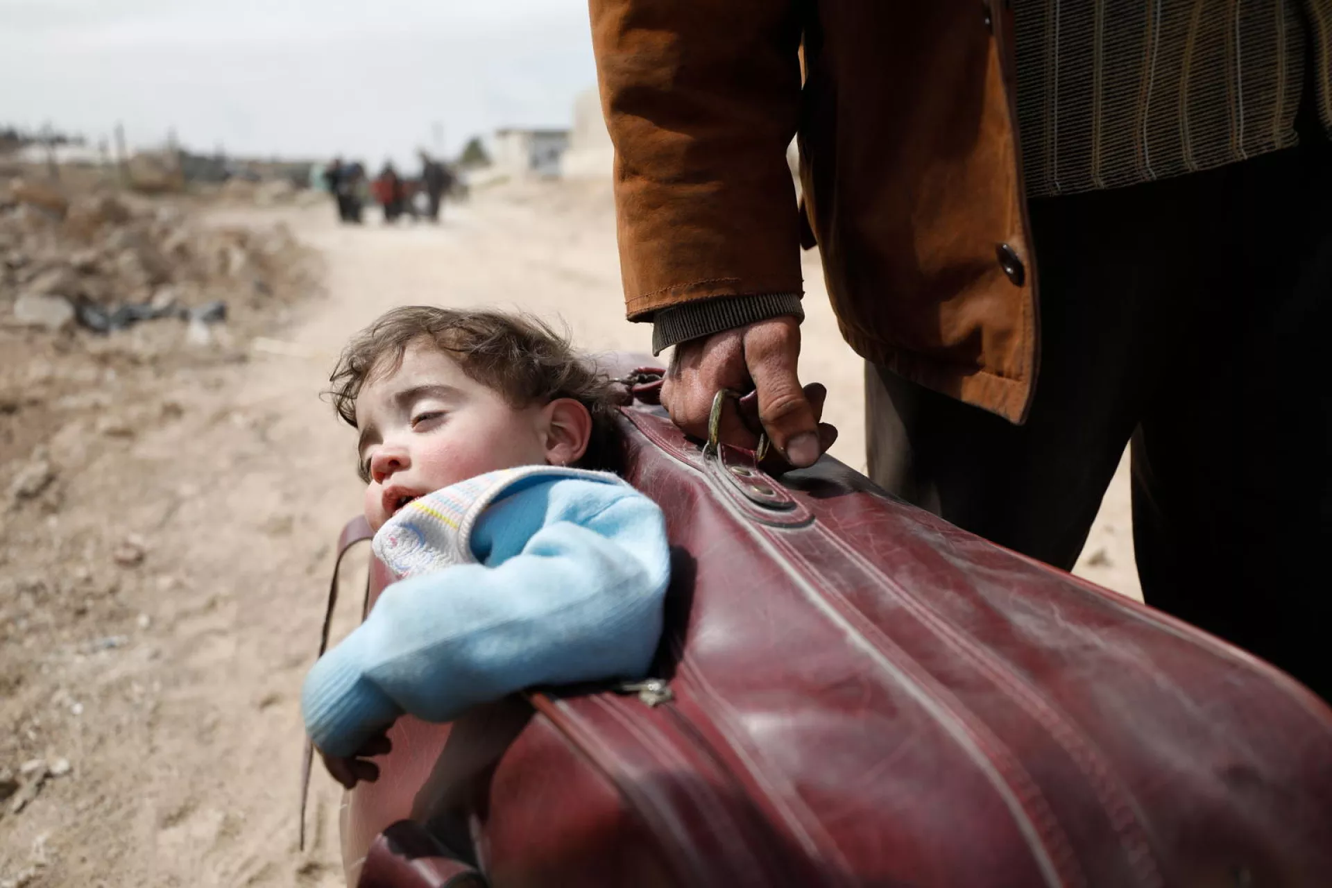 A child is carried in a suitcase, Syrian Arab Republic