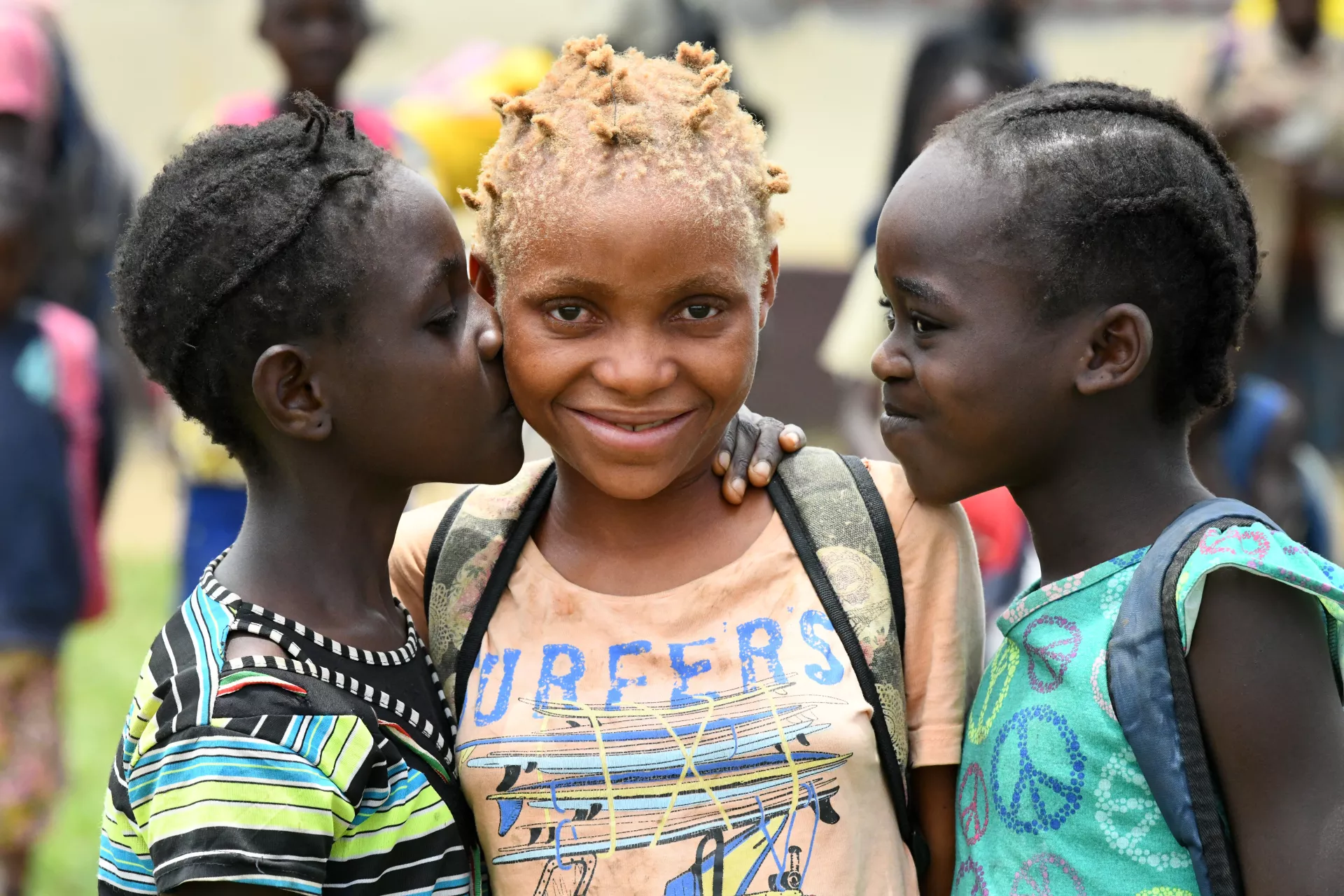 Convention on the Rights of the Child. Three girls stand together in Congo. 