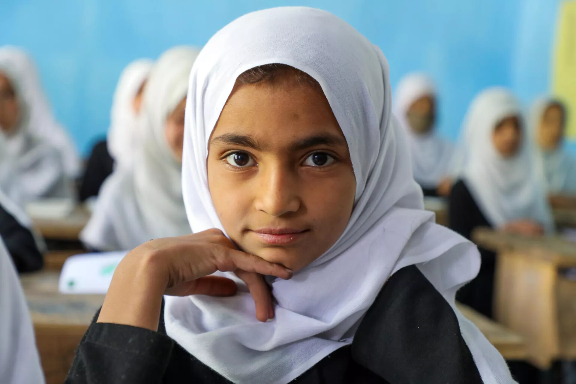 World Children's Day: A girl sits in a classroom in Afghanistan