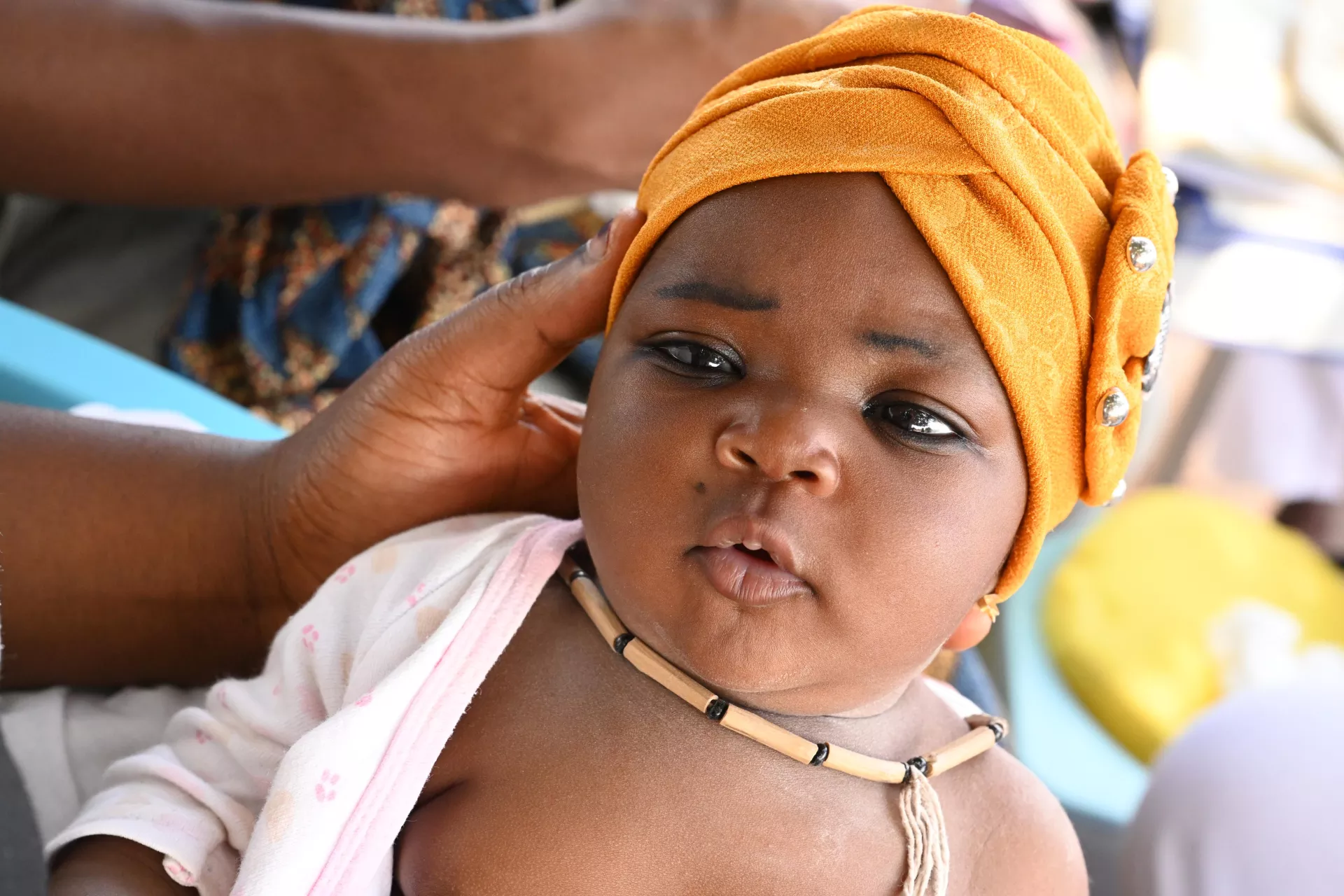 A baby waiting to be vaccinated.