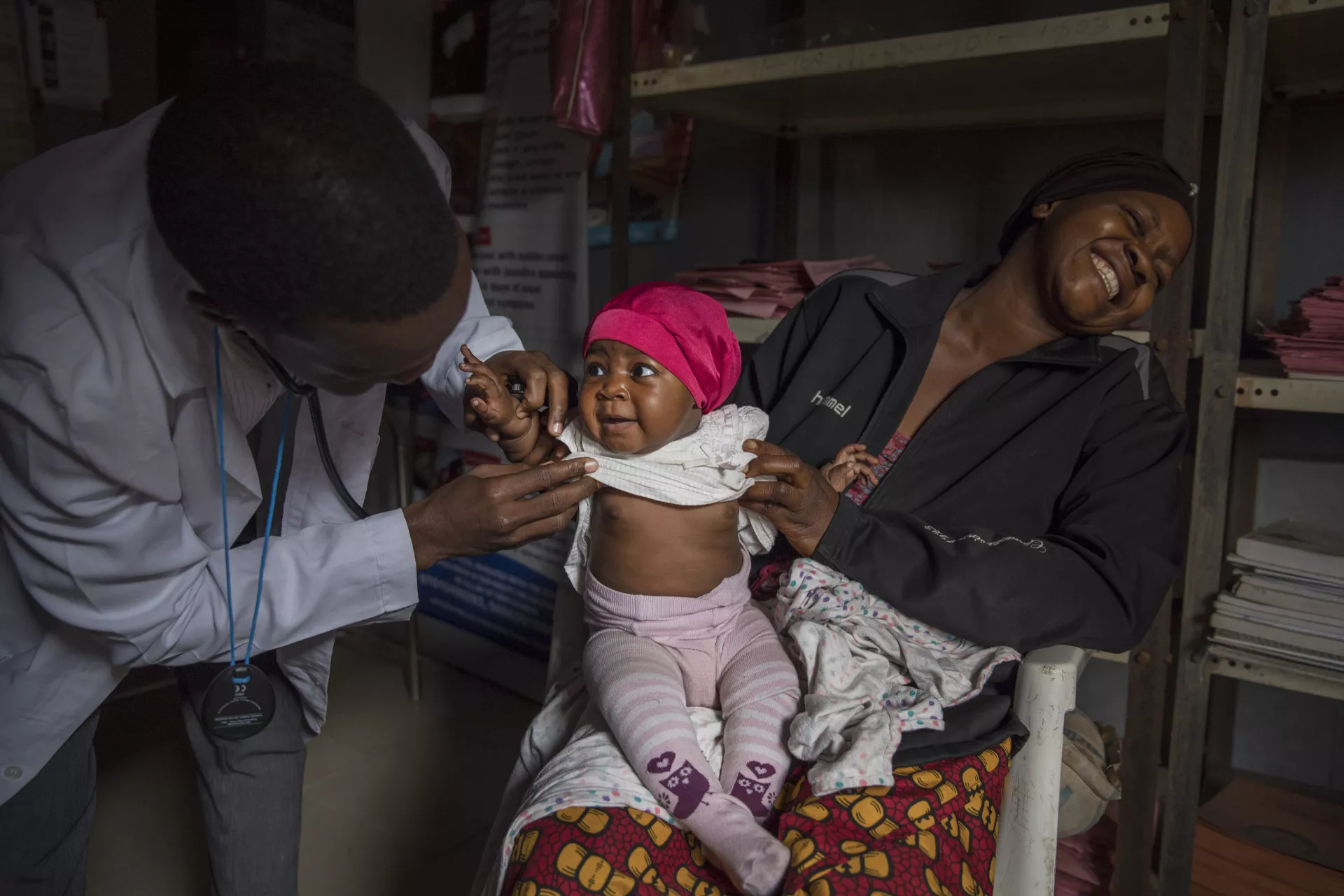 On 16 January 2020, a health worker examines one-year-old Beatrice in a health clinic in Yola, Adamawa state, northeastern Nigeria. 
