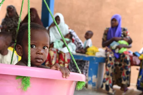 Niger. A baby is weighed and measured at a health center in Maradi.