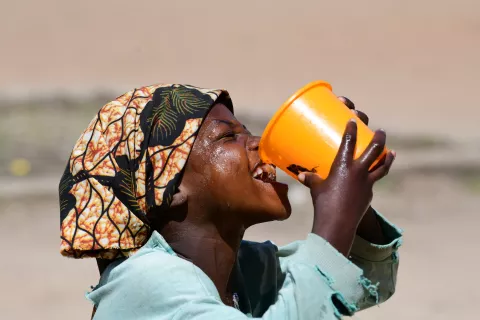 A girl drinking water at the playground of her school, in Goré, in the South of Chad.