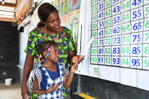 Five-year-old Rokiatou learns mathematics with her teacher Josiane Ake in the West of Côte d’Ivoire.
