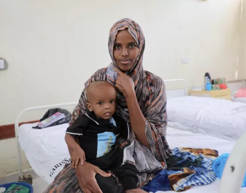 0-month-old Mansuur Osman is held by his mother, Harira Adow, at the stabilization centre of Garissa County Referral Hospital. Baby Mansuur is recovering from severe acute malnutrition caused by the prolonged drought experienced in Garissa.