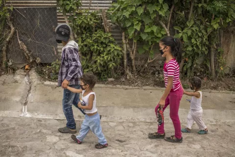 Children wear masks to get essentials at a nearby grocery store in Palencia, Guatemala. 