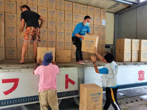 UNICEF staff and logistics support personnel load hygiene and dignity kits and other WASH supplies onto a truck from the UNICEF warehouse in Mindanao. This is the first shipment of emergency supplies to be sent to areas affected by Typhoon Odette/Rai, to support the Government's emergency response.