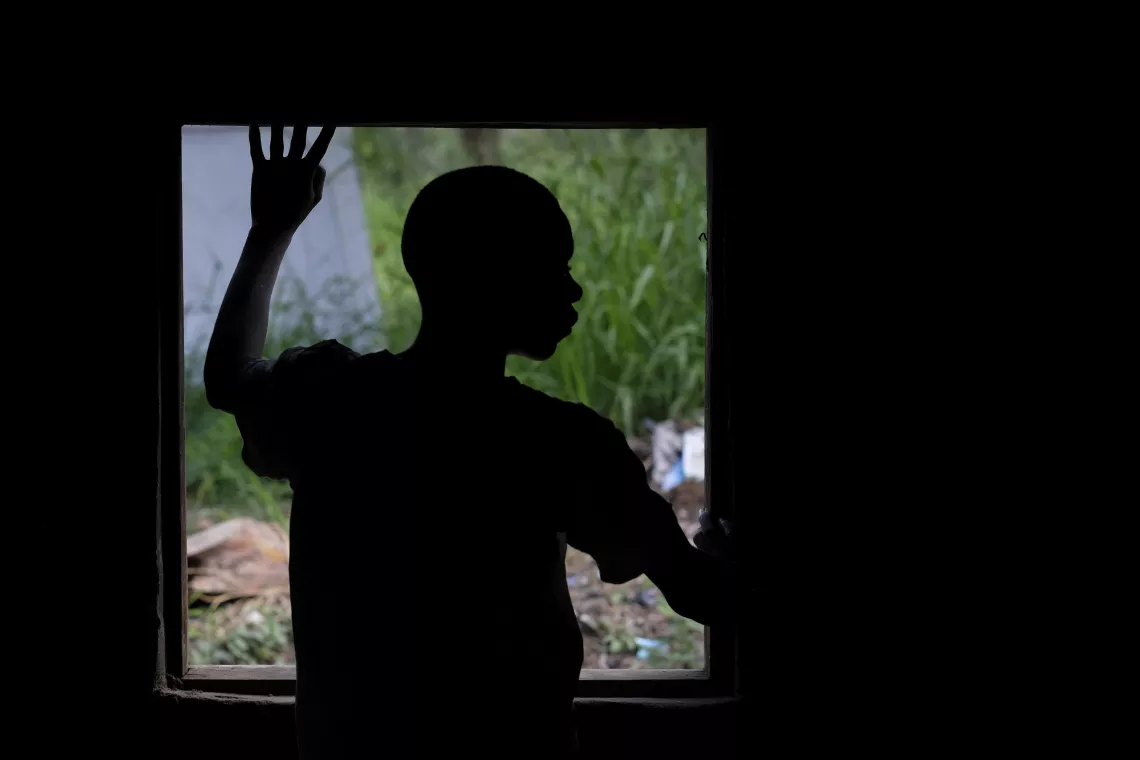 South Sudan. A boy who was abducted by an armed group looks out a window after being released.