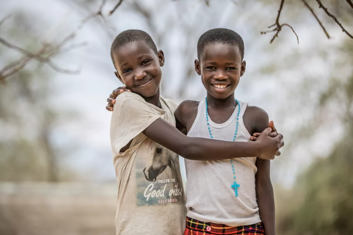 A portrait of young girls smiling away. They are some of the many young girls currently under the care of Kalas Girls' rescue center in Amudat District, Uganda.