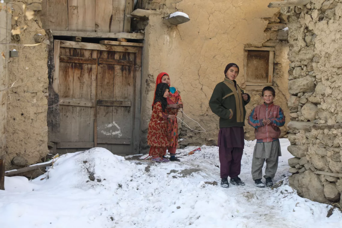 Afghanistan. Children stand in front of their home in Parun.