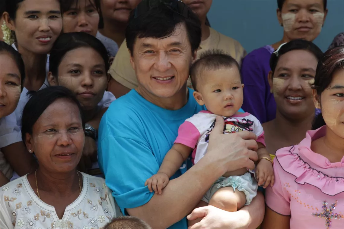UNICEF Goodwill Ambassador Jackie Chan meets with girls from the vocational training programme at the Deaf School in Mandalay, Myanmar, in 2012.