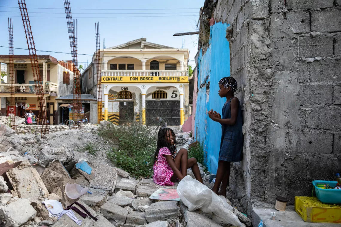 Haiti. Children play in the rubble of homes destroyed in the 2021 earthquake in Les Cayes