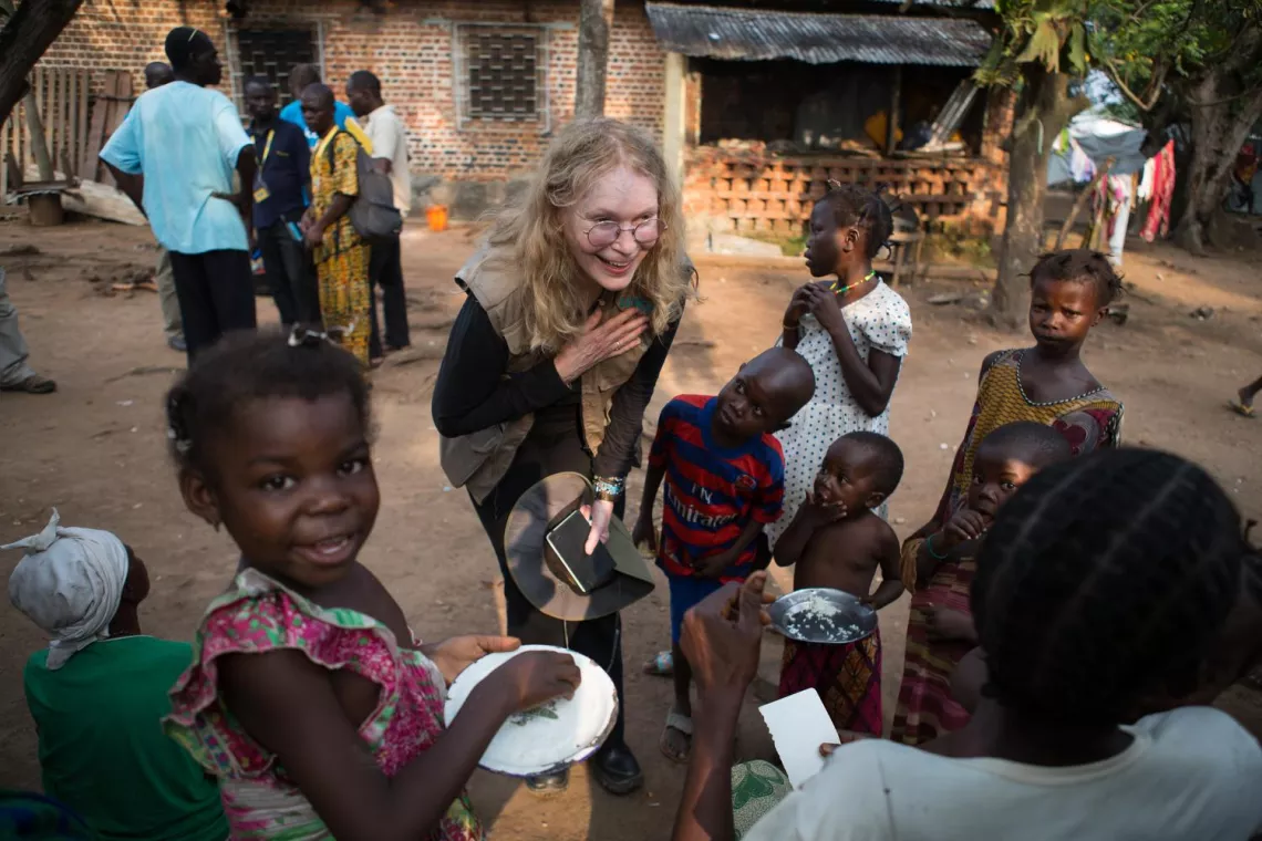 On 2 July, UNICEF Goodwill Ambassador Mia Farrow greets internally displaced mothers and their children in the St. Michel displacement site near the southern town of Boda in Lobaye Prefecture, Central African Republic.