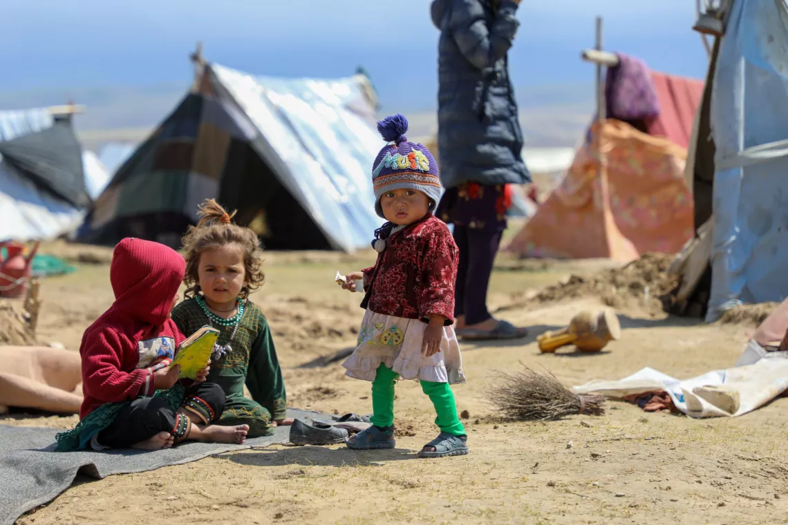 Afghanistan. Children play near tents in a settlement for internally displaced persons.
