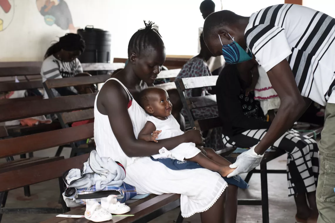 South Sudan. A child is examined at a health care centre.