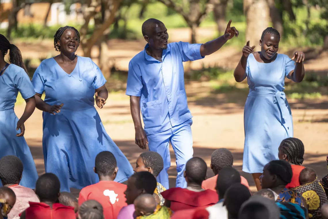 Community health workers chant about malaria prevention during their outreach health session near Chileka Health Center in Lilongwe district, Malawi.