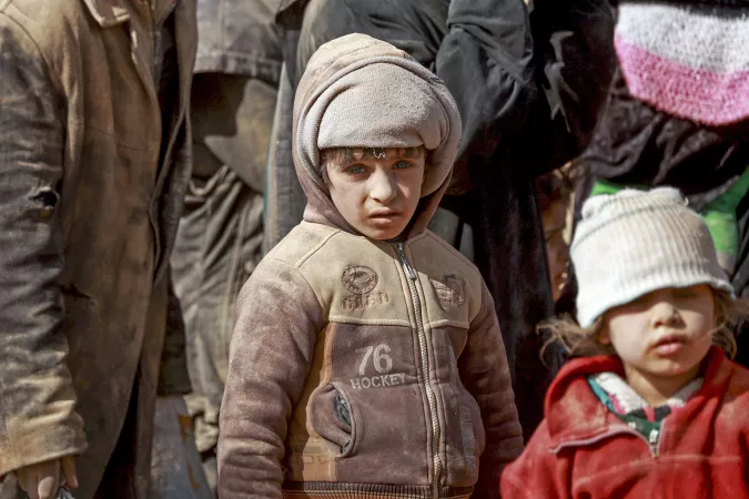 Syria. Children and families are huddled together after being forced to flee their homes.